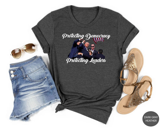 Trmp Flght T-shirt, Trmp Suicide Attempt, Never Surrender Shirt, Trmp Shooter, Anti Biden Shirt, Rally Protection,News Event Shirt 
T-shirt & Hoodie